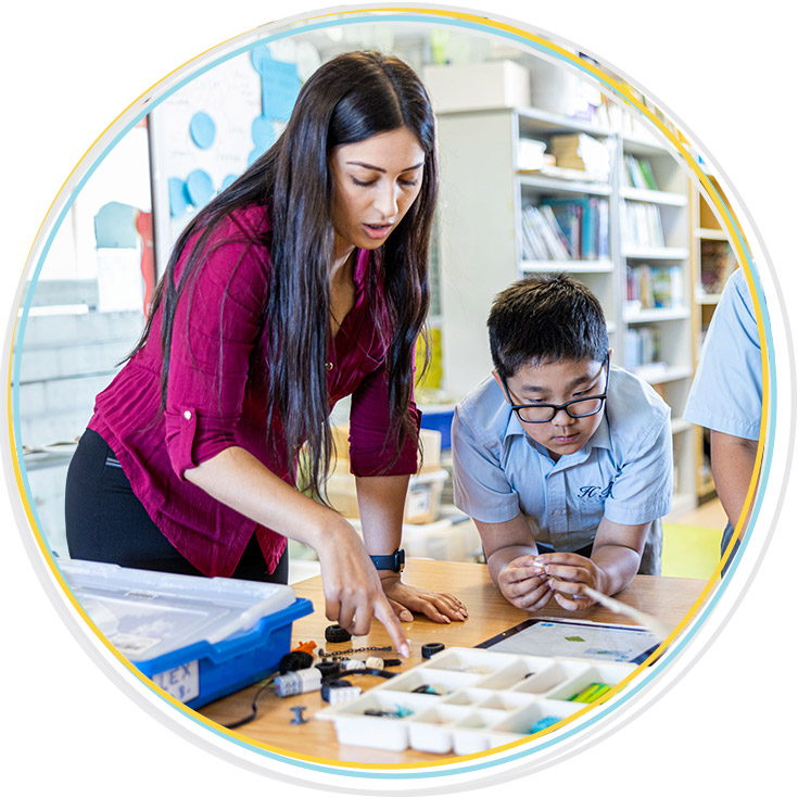 Teacher supporting student at Holy Family Catholic Primary East Granville