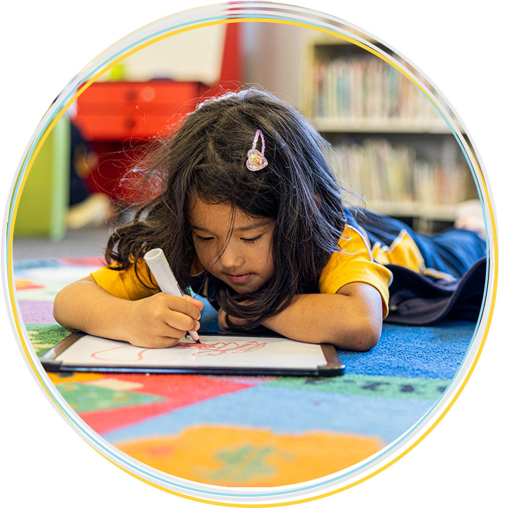 Girl learning in the Holy Family Catholic Primary East Granville school library