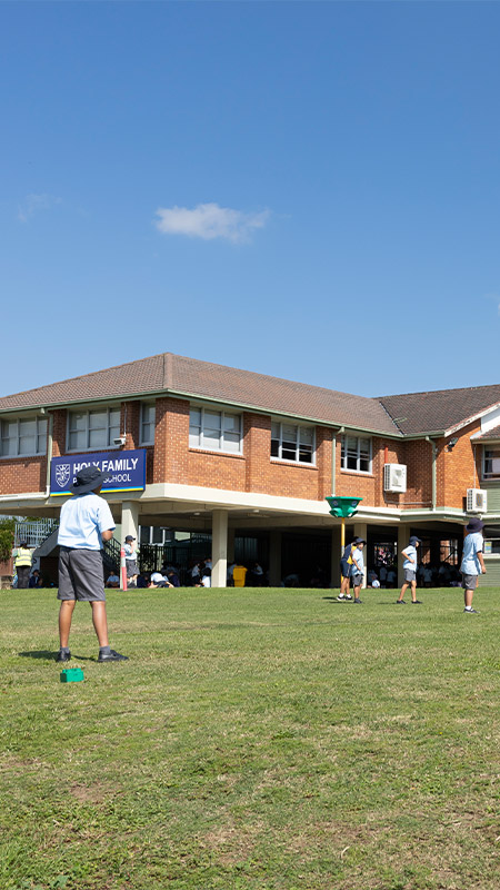 Students playing sports on the Holy Family Primary East Granville school grounds