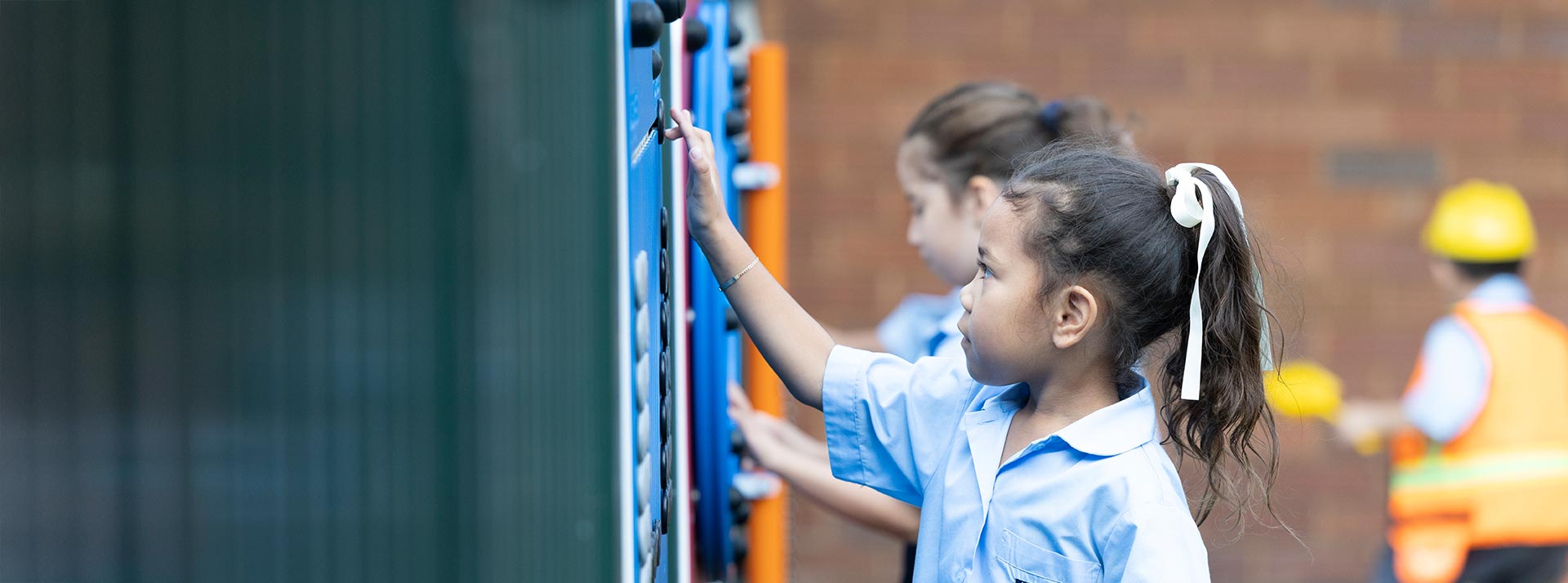 Holy Family Primary East Granville student playing with playground equipment
