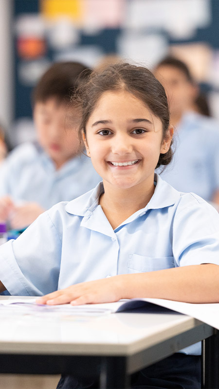 Happy student studying, at Holy Family Primary East Granville