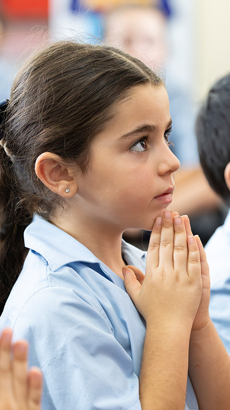 Holy Family Primary, East Granville student in prayer