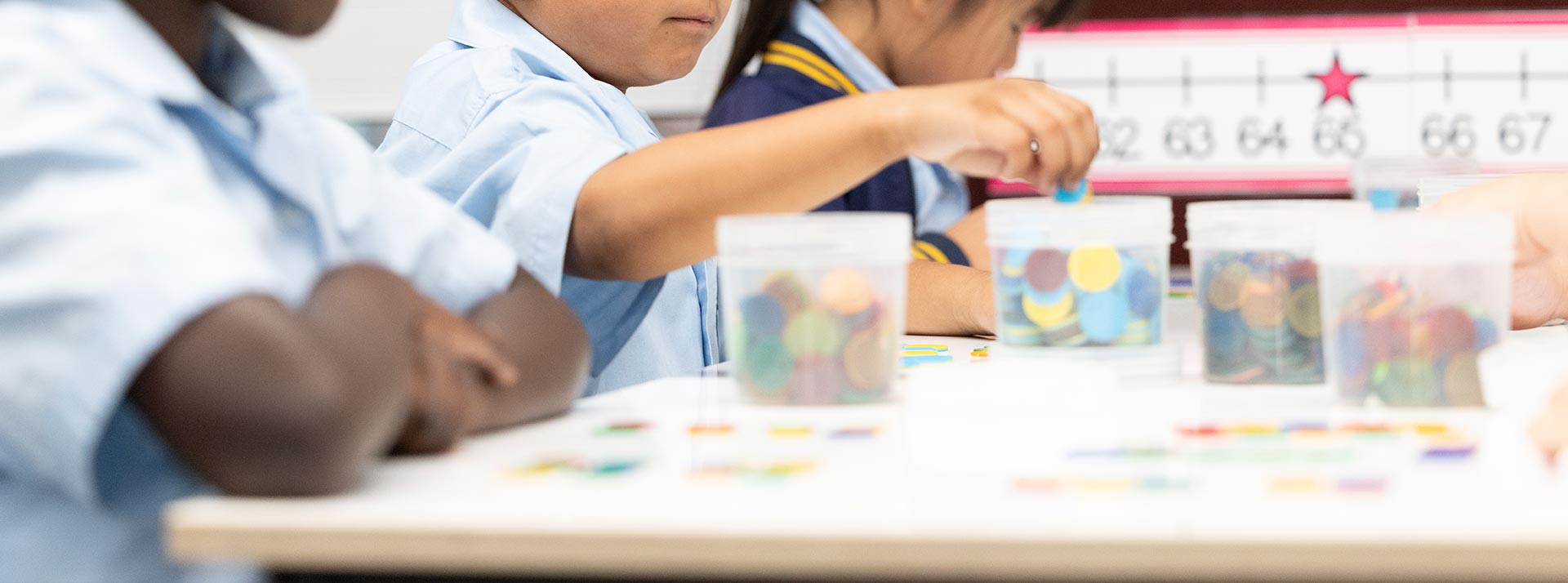 Students using counters in maths class