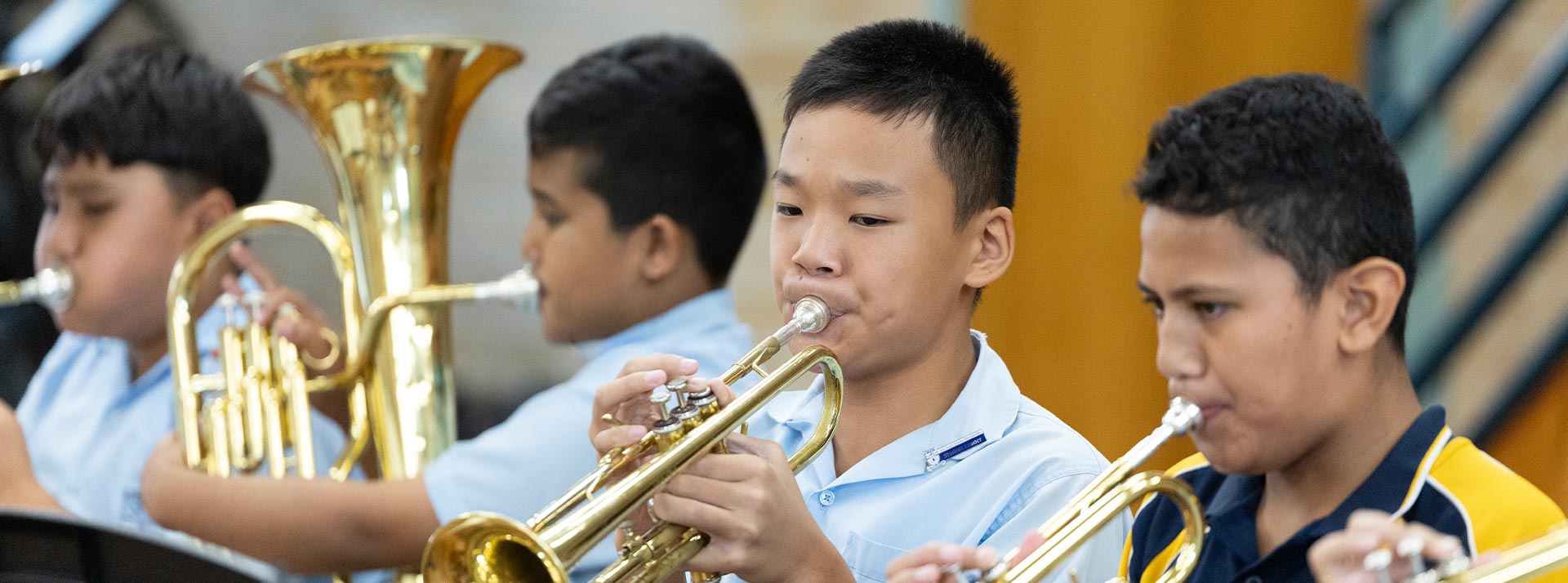 Holy Family Primary East Granville student playing trumpet