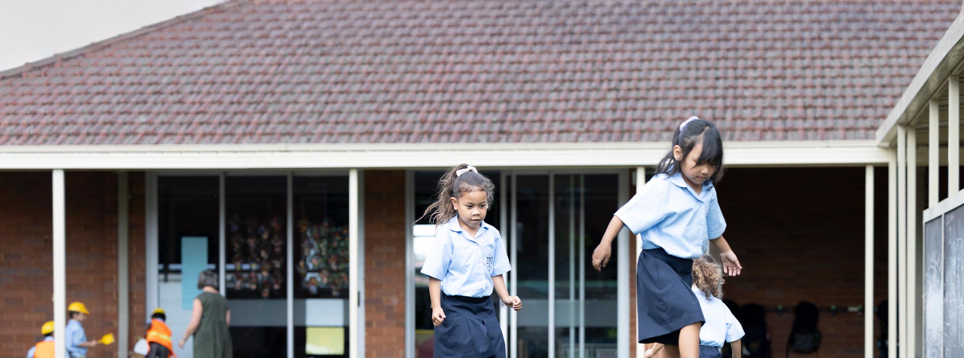 Holy Family Primary East Granville students on outdoor play equipment