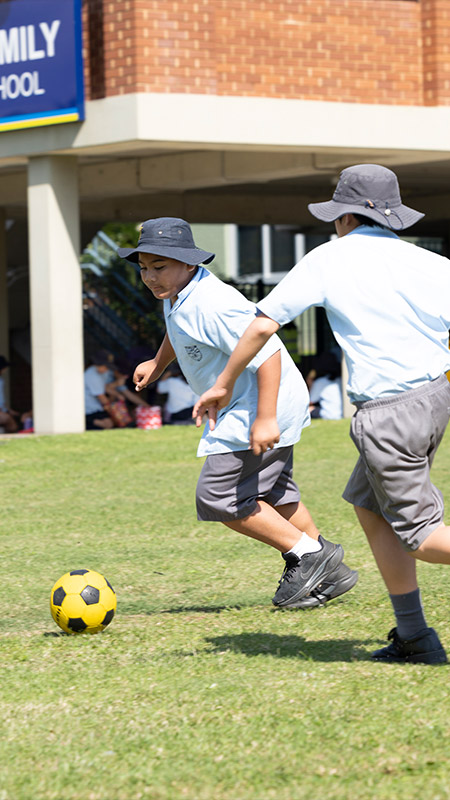 Holy Family Primary East Granville students playing sports