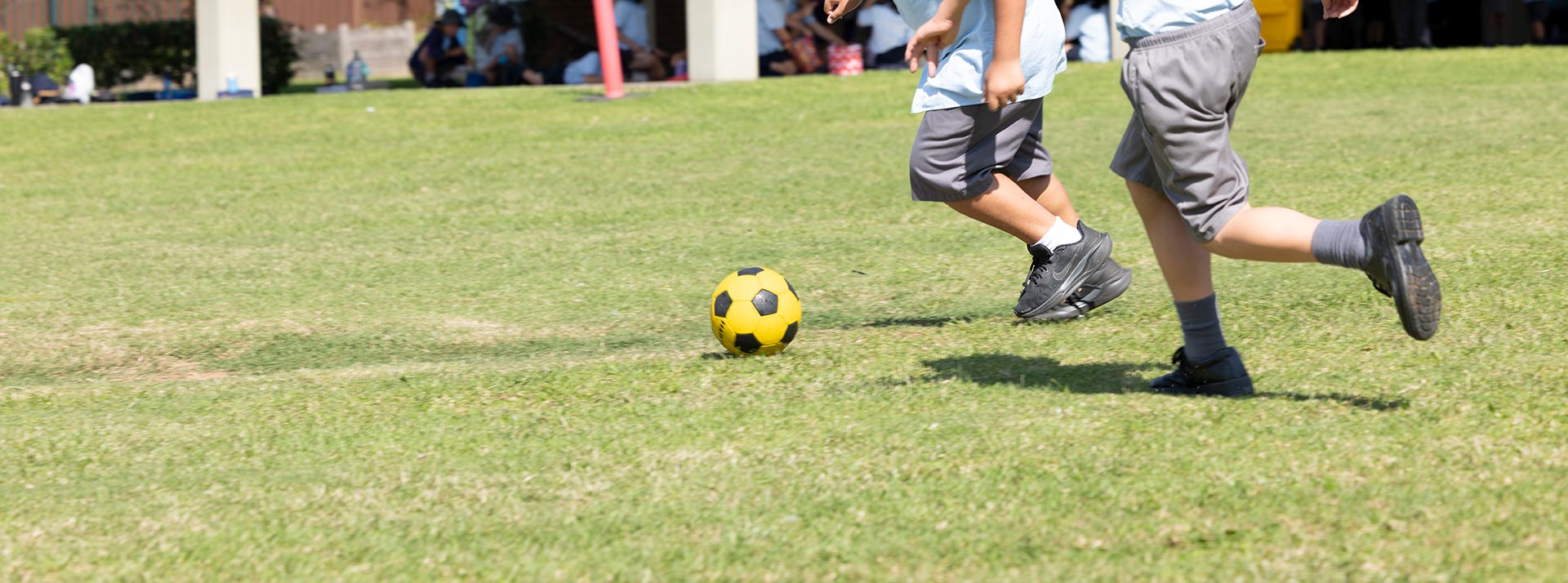 Holy Family Primary East Granville students playing sports