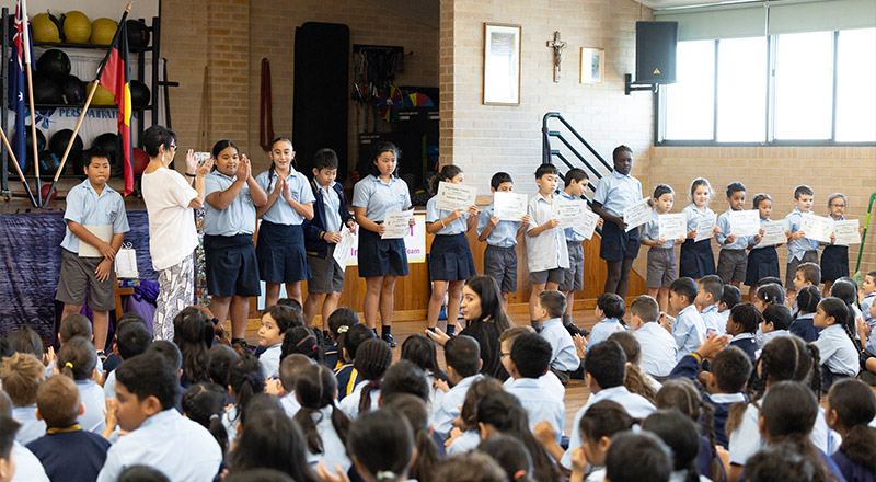Holy Family East Granville staff and students gathered in school hall