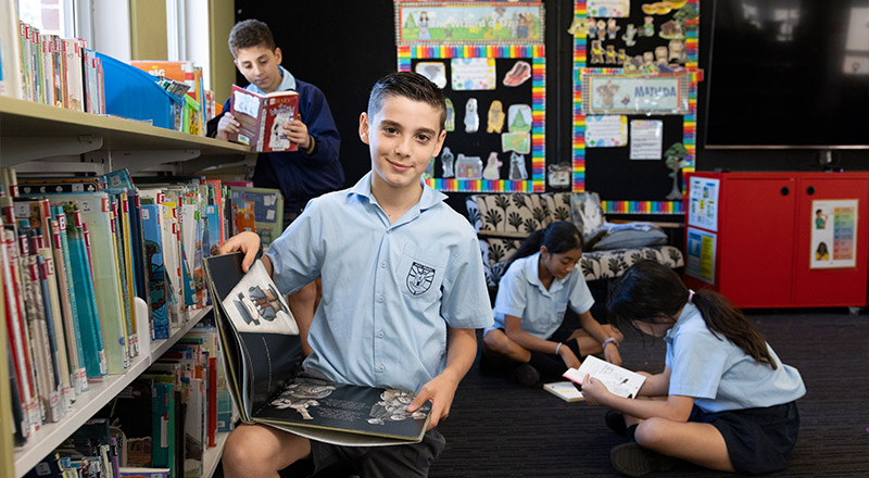 Holy Family Primary East Granville students in library