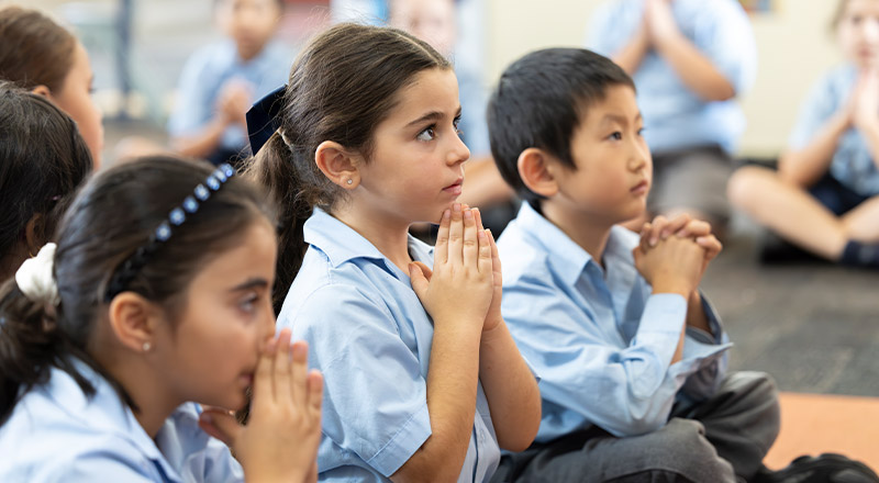 Holy Family Primary, East Granville students in prayer