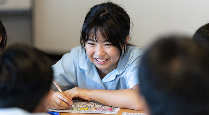 Happy student in class at Holy Family Primary, East Granville