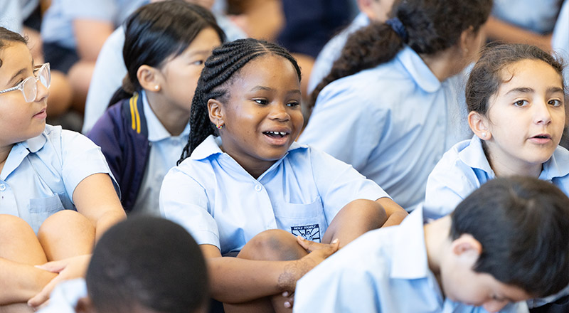 Happy student in school assembly