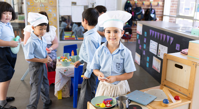 Child roleplaying as a chef