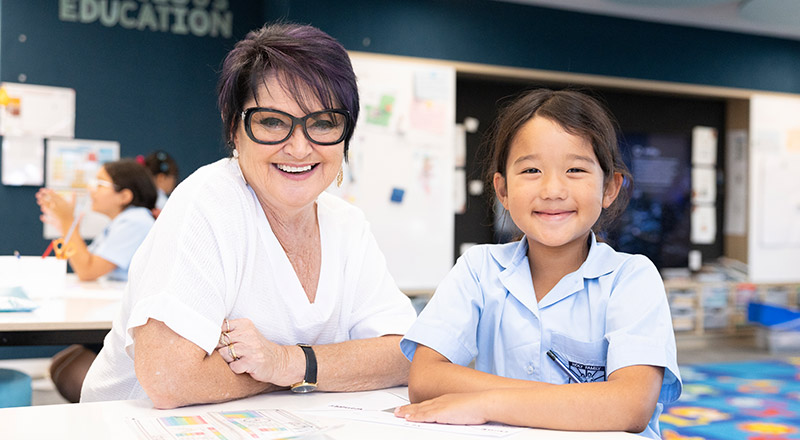 Cheryl Fortini, Principal of Holy Family East Granville, assisting students in class