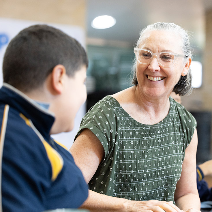 Teacher and student at Holy Family Primary, East Granville