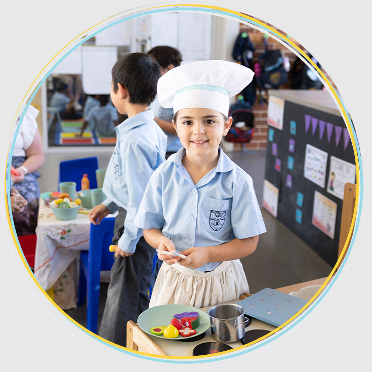 Holy Family Primary, East Granville student pretending to be a chef